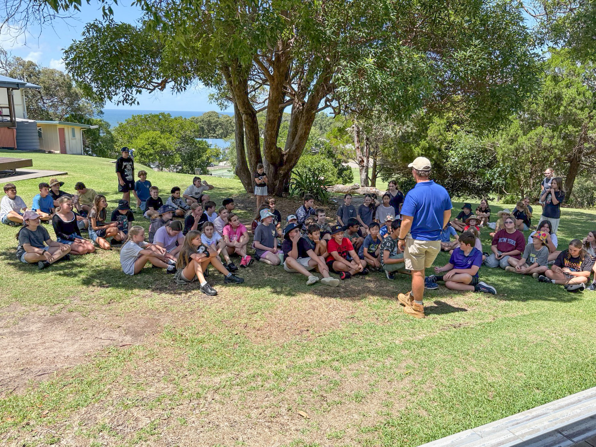 Group of students attending a briefing at the Year 7 camp
